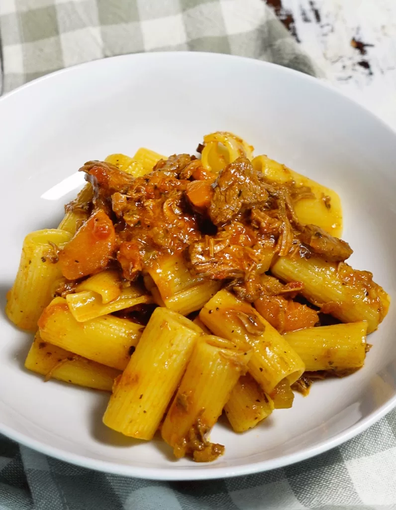 Beef ragu served with rigotoni pasta
